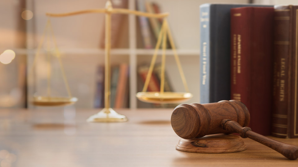 Court of law stock photography, a gavel and books, scales of justice.