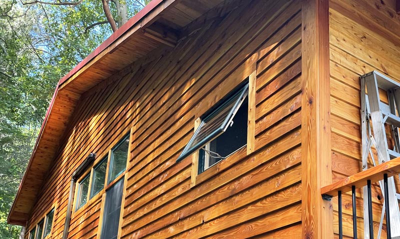 Example of Blue Spruce Painting work- exterior stain on cabin